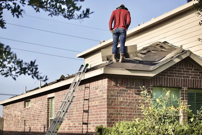 Professional roofer working on a residential roof in Loantaka Estates